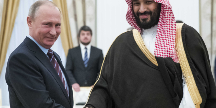 Russian President Vladimir Putin (L) shakes hands with Saudi Deputy Crown Prince and Defence Minister Mohammed bin Salman during a meeting at the Kremlin in Moscow on May 30, 2017. / AFP PHOTO / POOL / Pavel Golovkin