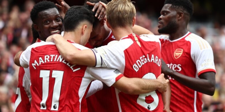 Arsenal's English midfielder  #07 Bukayo Saka is mobbed by teammates after scoring the team's second goal during the English Premier League football match between Arsenal and Nottingham Forest at the Emirates Stadium in London on August 12, 2023. (Photo by HENRY NICHOLLS / AFP) / RESTRICTED TO EDITORIAL USE. NO USE WITH UNAUTHORIZED AUDIO, VIDEO, DATA, FIXTURE LISTS, CLUB/LEAGUE LOGOS OR 'LIVE' SERVICES. ONLINE IN-MATCH USE LIMITED TO 120 IMAGES. AN ADDITIONAL 40 IMAGES MAY BE USED IN EXTRA TIME. NO VIDEO EMULATION. SOCIAL MEDIA IN-MATCH USE LIMITED TO 120 IMAGES. AN ADDITIONAL 40 IMAGES MAY BE USED IN EXTRA TIME. NO USE IN BETTING PUBLICATIONS, GAMES OR SINGLE CLUB/LEAGUE/PLAYER PUBLICATIONS. - RESTRICTED TO EDITORIAL USE. No use with unauthorized audio, video, data, fixture lists, club/league logos or 'live' services. Online in-match use limited to 120 images. An additional 40 images may be used in extra time. No video emulation. Social media in-match use limited to 120 images. An additional 40 images may be used in extra time. No use in betting publications, games or single club/league/player publications. /