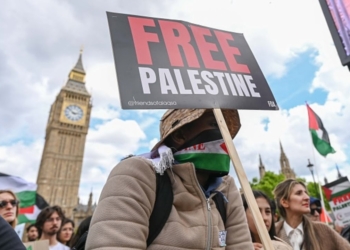 LONDON, UNITED KINGDOM - JUNE 08: A protester holds a placard reading 'Free Palestine' as thousands attend a pro-Palestinian protest, with Palestinian flags and anti-war placards, demanding the end to the Israeli attacks on Gaza in London, United Kingdom on June 08, 2024. (Photo by Raid Necati Aslm/Anadolu via Getty Images)