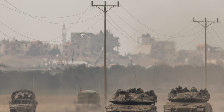 Israeli tanks re-enter Israel from Gaza, amid the ongoing conflict between Israel and the Palestinian Islamist group Hamas, near the Israel-Gaza border, in southern Israel, January 11, 2024. REUTERS/Tyrone Siu